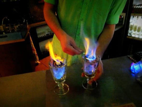 Flaming shots of absinthe